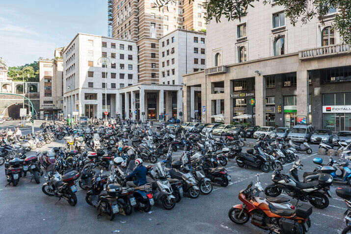 A large group of motorcycles parked in a parking lot

AI-generated content may be incorrect.